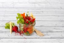Healthy raw salad in a jar with space for text — Stock Photo