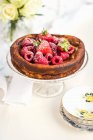 Low fat Quark cheesecake with fresh berries on a cake stand — Stock Photo