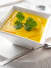 Carrot soup in white bowl — Stock Photo