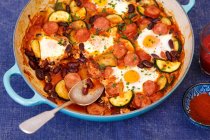 Sausage, kidney bean and courgette bake with eggs — Stock Photo
