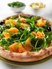 Salmon pizza with arugula — Stock Photo