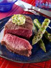 A plate of filet mignon and grilled asparagus — Stock Photo