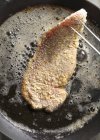 Frying Wiener Schnitzel in a pan — Stock Photo