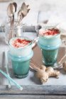 Smurf latte (vegan plant milk, blue spirulina, ginger and beetroot powder) — Stock Photo