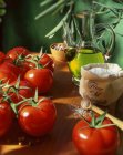 Fresh tomatoes, fleur de sel and olive oil — Stock Photo