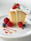 Spanish traditional sponge cake with evaporated and condensed milk topped with whipped cream and fruit — Stock Photo