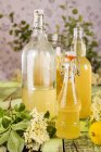 Homemade elderberry syrup with lemon — Stock Photo