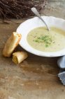 Fennel soup with baguette — Stock Photo