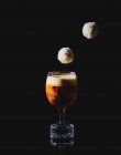 An espresso macchiato with truffle pralines — Stock Photo