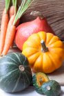 Various pumpkins and carrots close-up view — Stock Photo