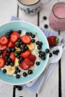Porridge with berries and bananas — Stock Photo