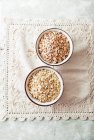 Organic Spelt and Oat Flakes in ceramic bowls — Stock Photo
