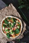 Homemade pizza with tomato, bocconcini and basil (seen from above) — Stock Photo