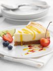 Lemon cheesecake slice on white plate — Stock Photo