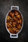 Roast chicken wings in a roasting tin — Stock Photo