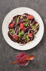 Beetroot carpaccio with raspberries and red onions — Stock Photo