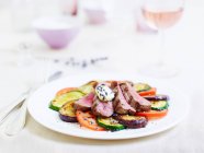 Tagliata with grilled vegetables and lavender — Stock Photo