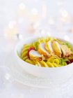 Crab tails in saffron and leek sauce with fusilli pasta and roasted tomatoes — Stock Photo