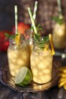 Mango lassi in bottles close-up view — Stock Photo