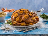 Whole Turkey glazed with orange slices — Stock Photo