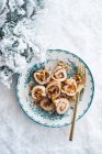 Stuffed turkey breast on a plate in the snow at Christmas — Stock Photo