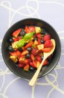 Fruit salad with berries, melon and basil — Stock Photo