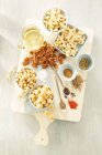 Ingredients for savoury spiced nuts — Stock Photo