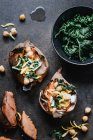 Baked sweet potatoes with kale and chickpeas — Stock Photo