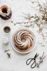 Cup of coffee and cinnamon sticks on white marble background. top view. — Stock Photo