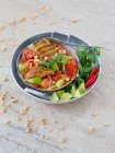 Lime chicken with tomatoes, coriander and nuts — Stock Photo