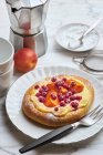 Sweet yeast flat bread with quark cream, redcurrants and apricots — Stock Photo