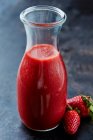 Strawberry smoothie in a carafe — Stock Photo