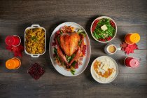 Roast turkey with orange glaze and side dishes — Stock Photo