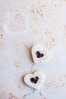 Heart shaped cookies with raspberry jam — Stock Photo