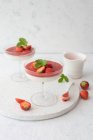 Panna cotta with strawberries and coulis — Stock Photo