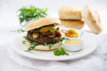 Vegan burgers with chia buns and a swede and bean patty — Stock Photo