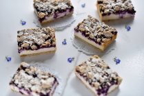 Vegan marzipan and blueberry cheesecake with almond crumbles — Stock Photo