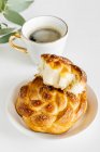 Braided sweet vanilla buns and coffee — Stock Photo