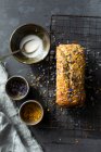 Banana and courgette bread with edible flowers — Stock Photo