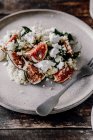 Salad with millet, cottage cheese, spinach and figs — Stock Photo