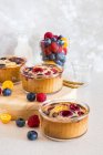 Oat cakes with chia seeds, raspberry, blueberry, kumquat and chocolate — Stock Photo