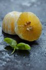 Peeled orange halves close-up view — Stock Photo