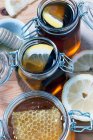 Organic honey with honey comb in mason jar — Stock Photo