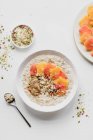 Oatmeal with oranges pumpkin seeds and peanut butter — Stock Photo