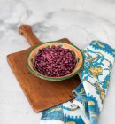 Red beans in a bowl on a wooden background — Stock Photo