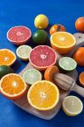 A variety of citrus fruit on board — Stock Photo