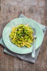 Ribbon pasta with wild garlic pesto — Stock Photo