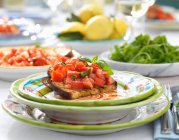 Delicious salmon salad with vegetables and herbs — Stock Photo