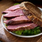 Corned beef sandwich on marble rye with lettuce — Stock Photo