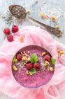 Smoothie bowl with raspberries, oat flakes and chia seeds — Stock Photo